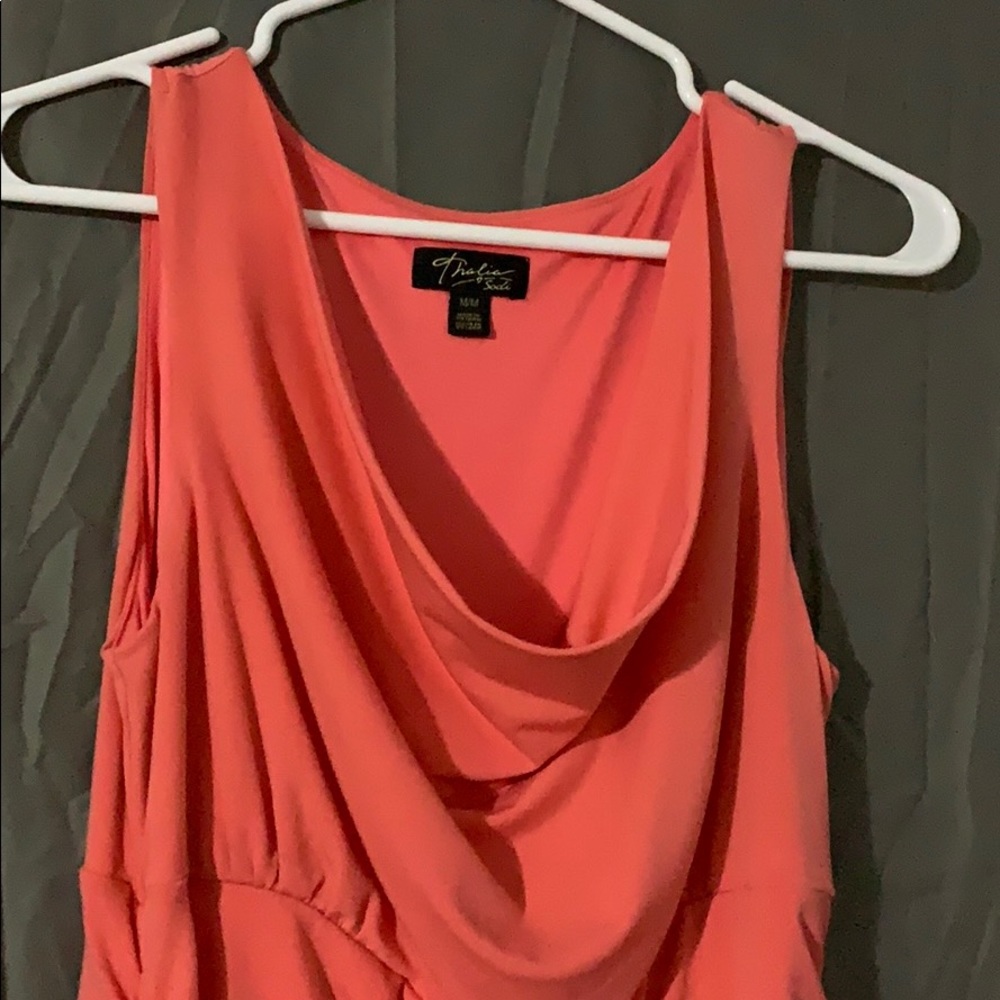 Sleeveless coral dress with ruched sides